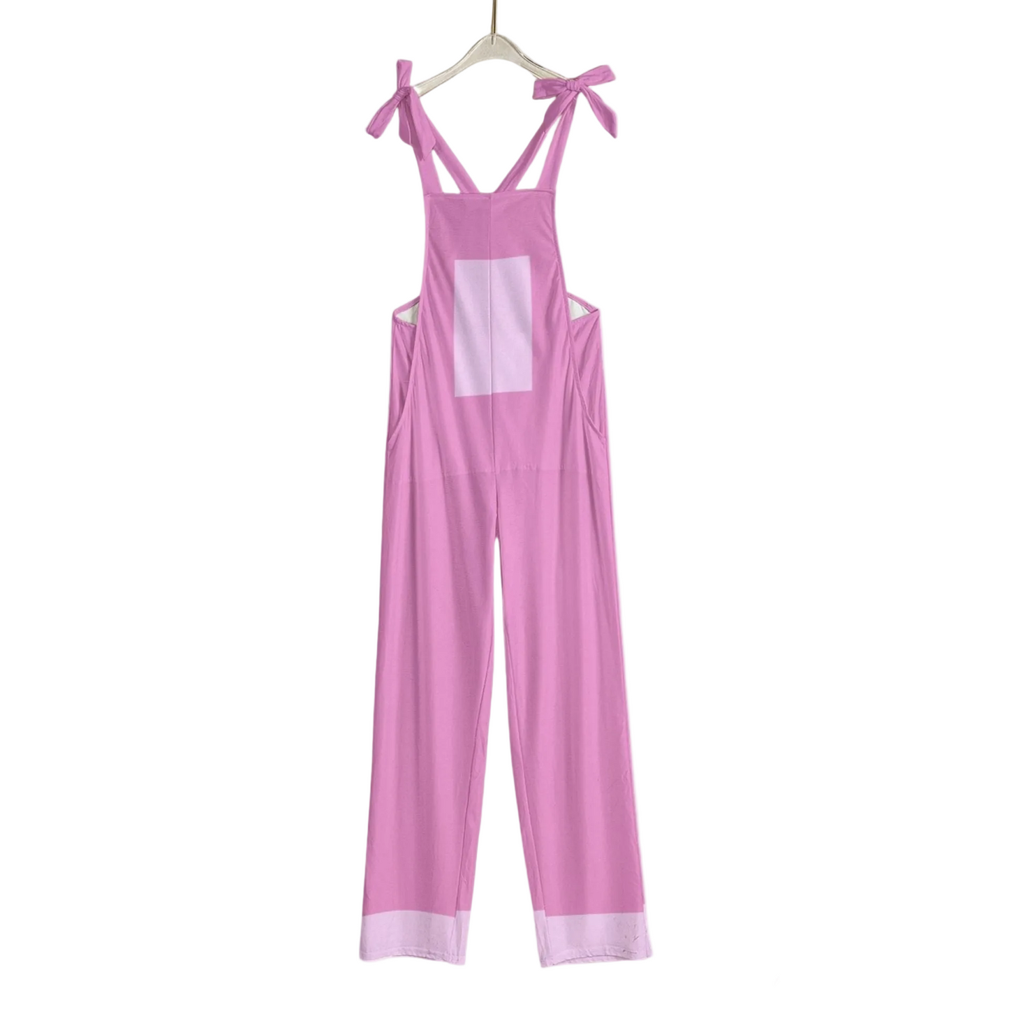 Pink jumpsuit with thin straps on a white background