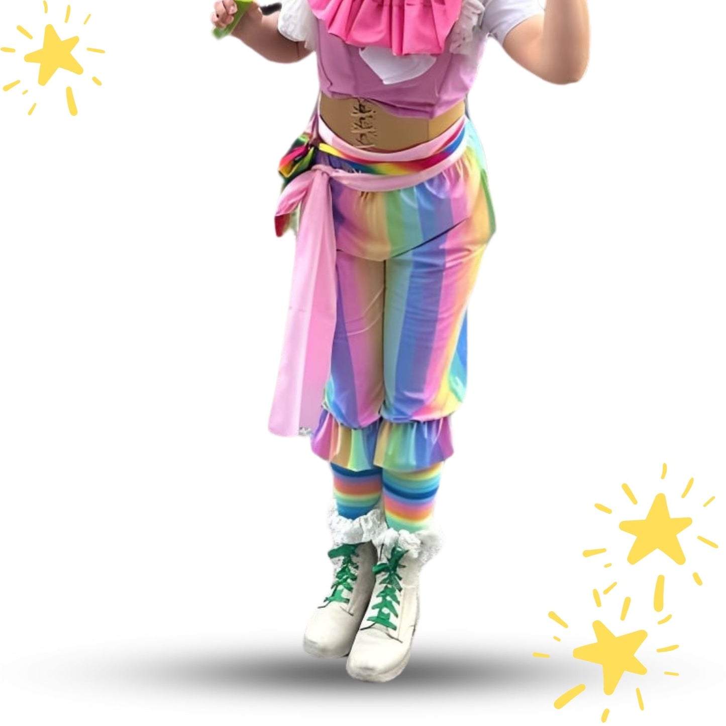 Person wearing a colorful outfit with rainbow pants and pink top on a white background