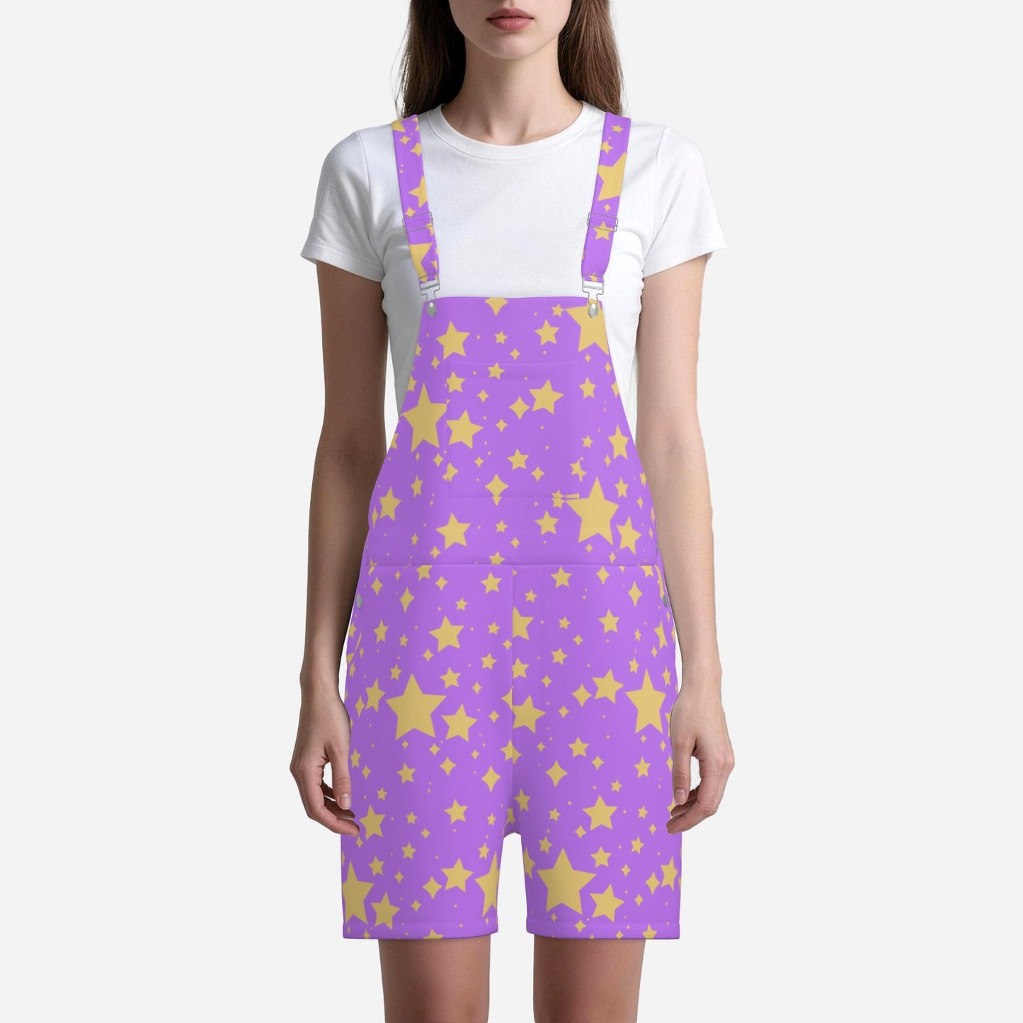 Person wearing a purple short overalls with yellow star pattern on a white background