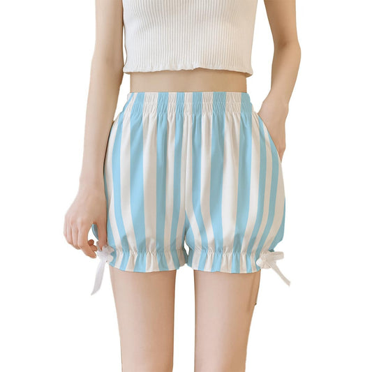 Blue and white striped shorts worn by a person on a white background