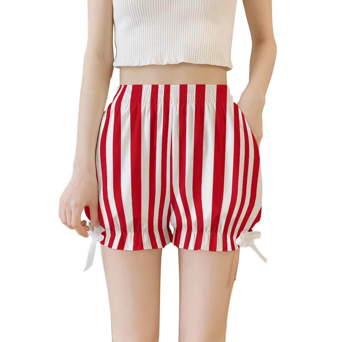 Red and white striped shorts worn by a person on a white background