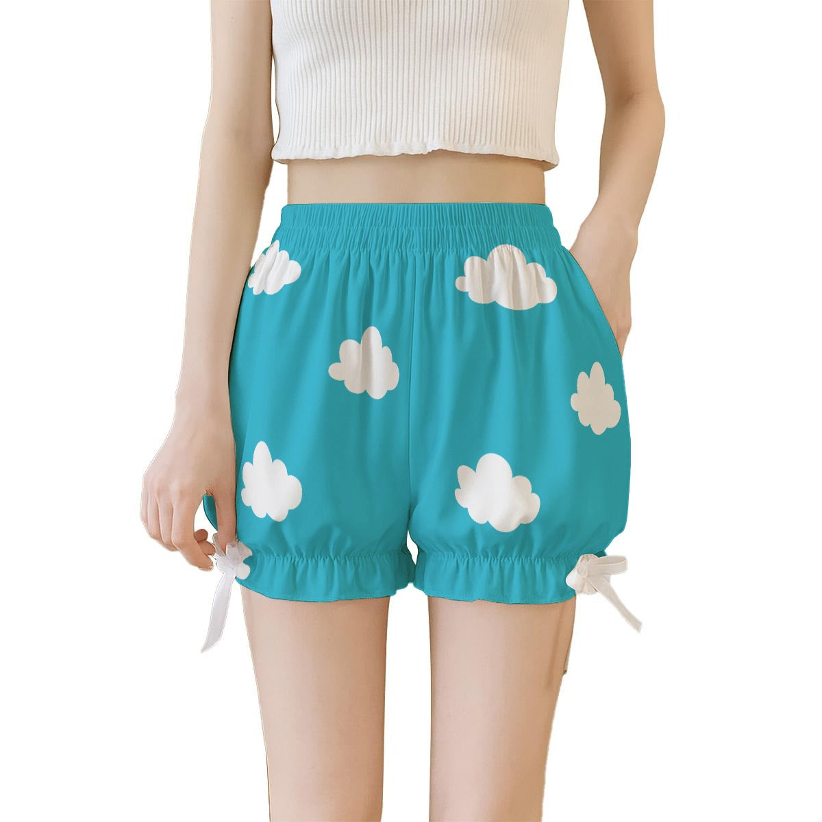 Turquoise shorts with cloud pattern worn by a person on a white background