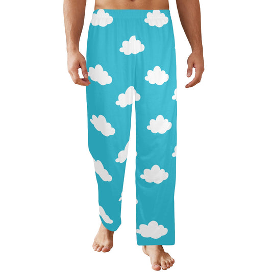 A person wearing light blue pajama pants featuring white cloud patterns, standing barefoot. The pants are loose-fitting and end at the ankles.