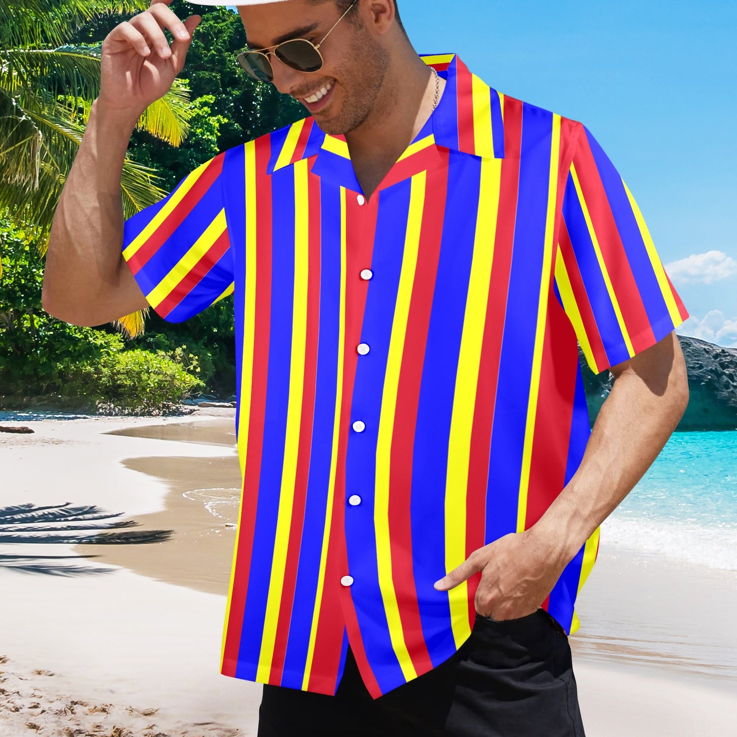 Man wearing a colorful striped shirt on a beach