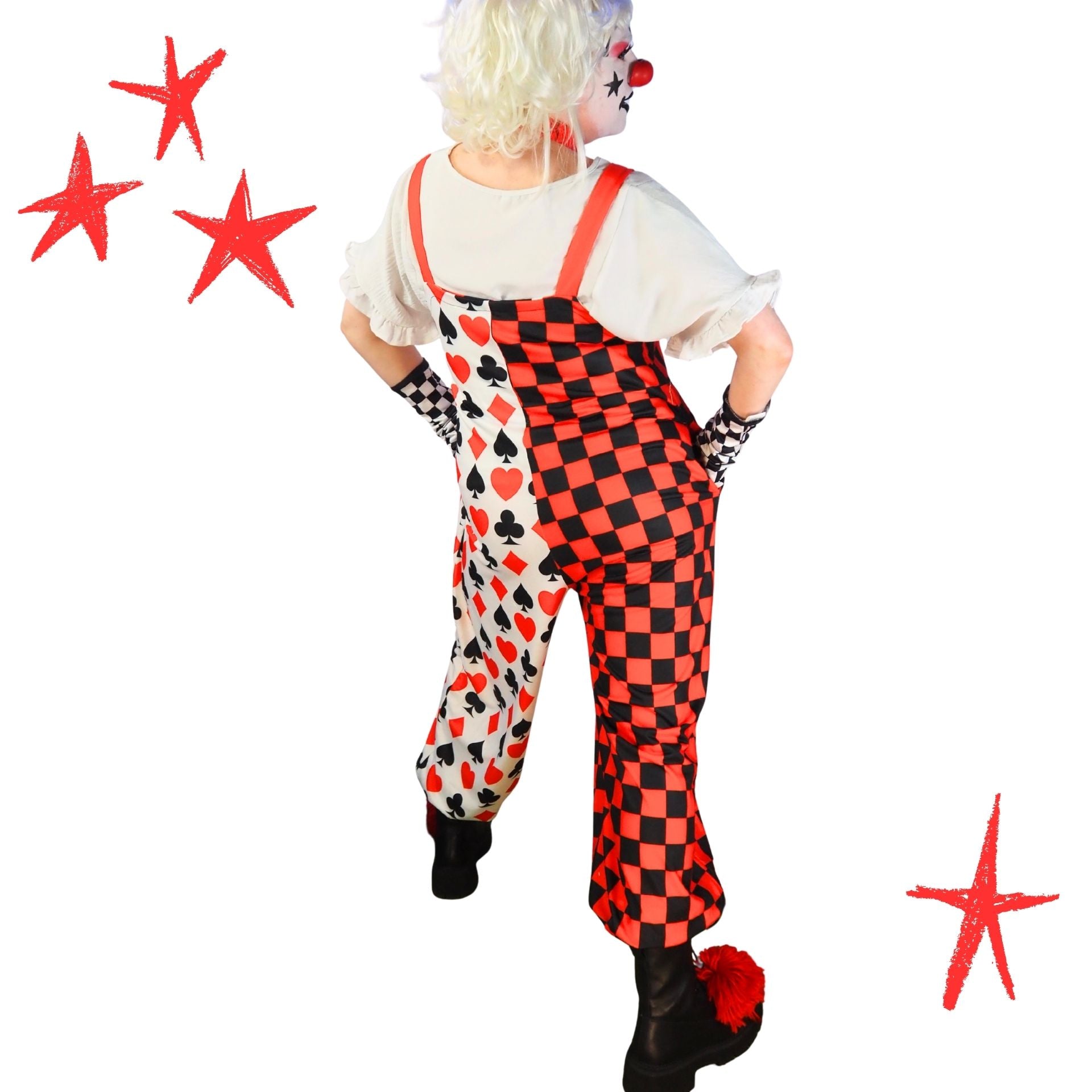 Person wearing a clown costume with checkered pants and red stars on a white background