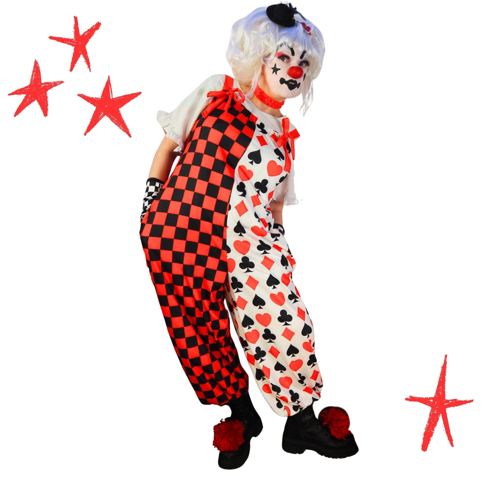 Clown in a checkered and card suit costume with red stars on a white background