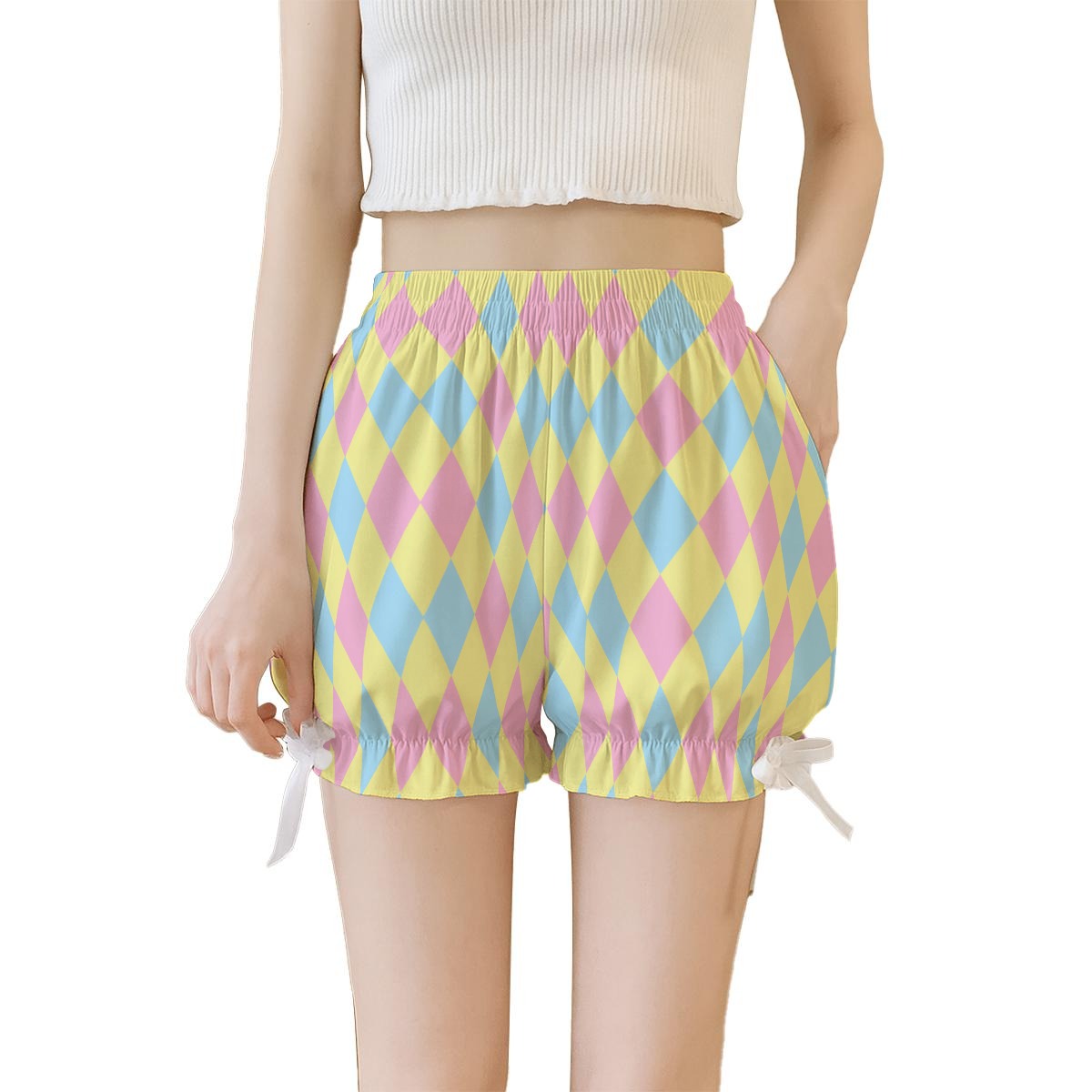 Pastel harlequin patterned shorts worn by a person on a white background