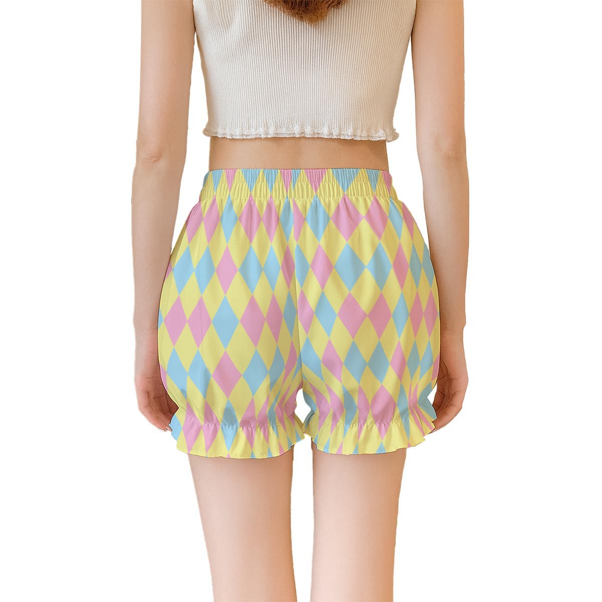Pastel harlequin patterned shorts worn by a person on a white background