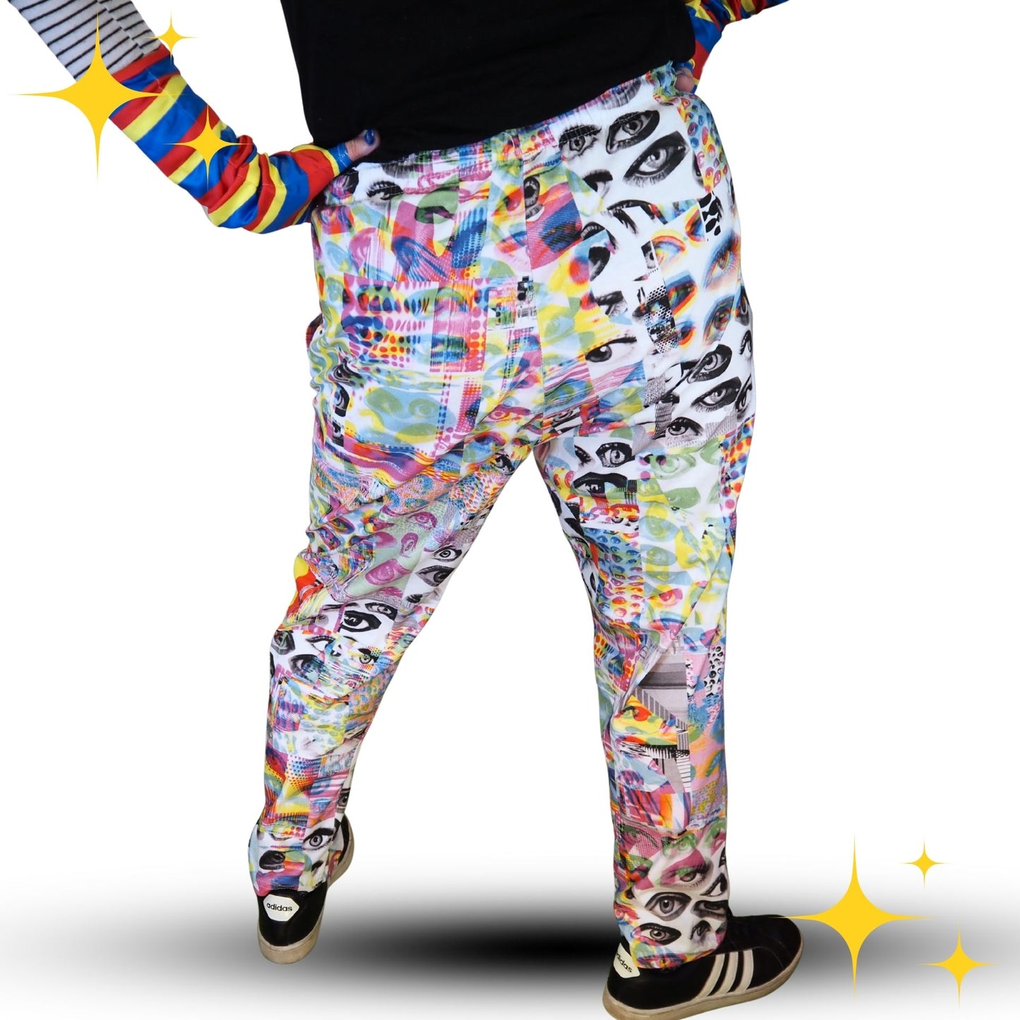 Colorful patterned pants worn by a person on a white background