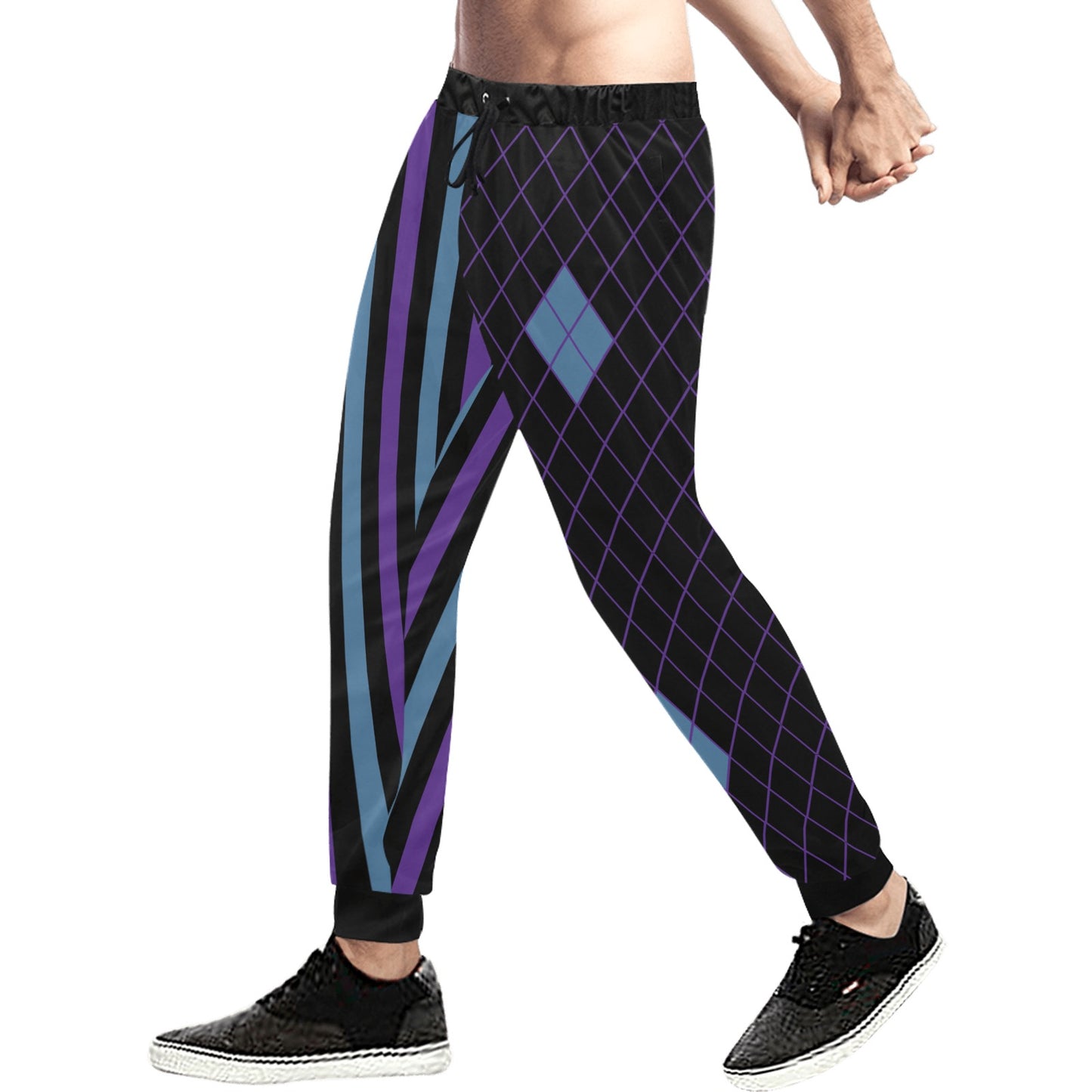 Person wearing black pants with blue and purple geometric pattern on a white background