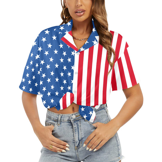 Woman wearing a colorful American flag shirt with denim shorts on a white background