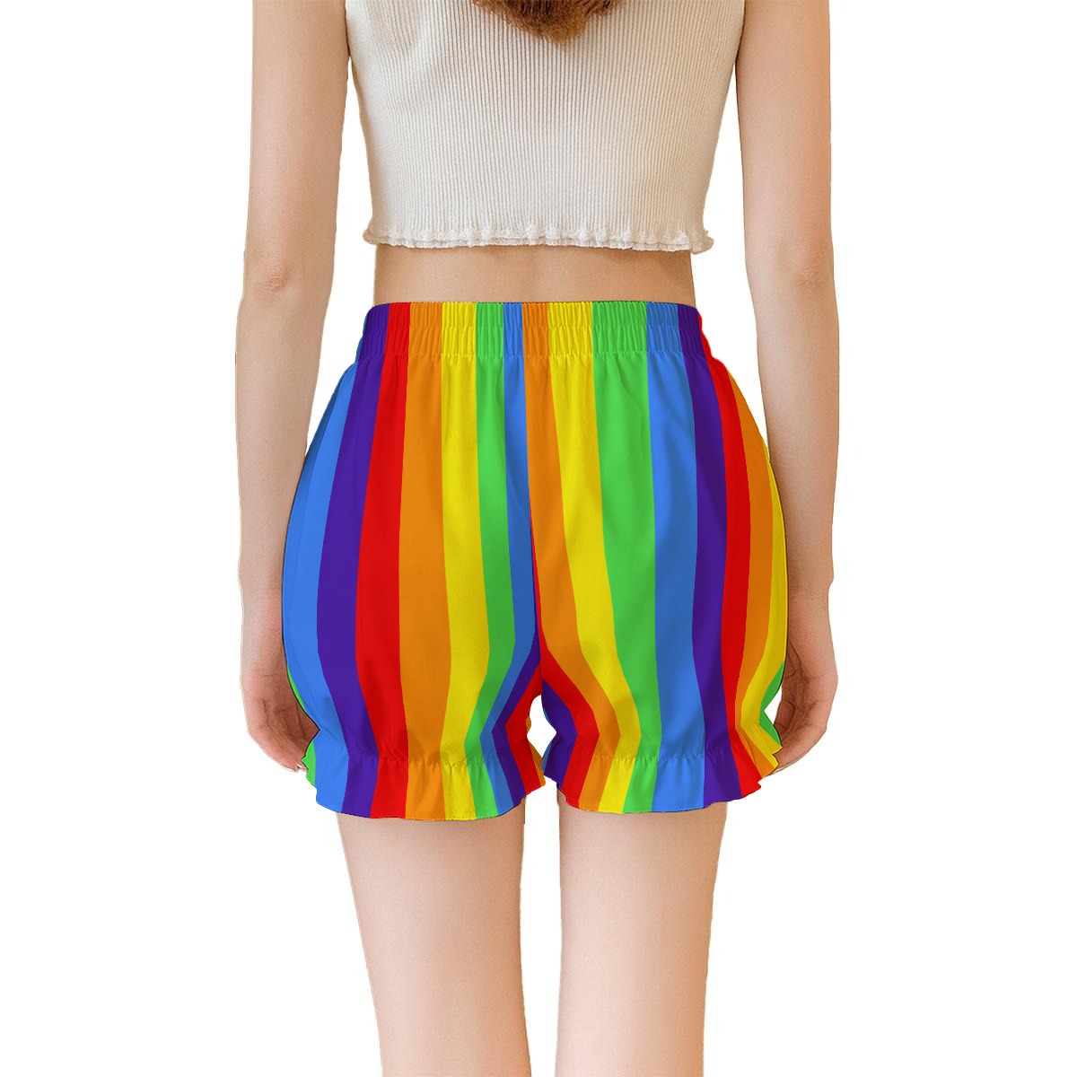 Person wearing a colorful rainbow striped shorts on a white background