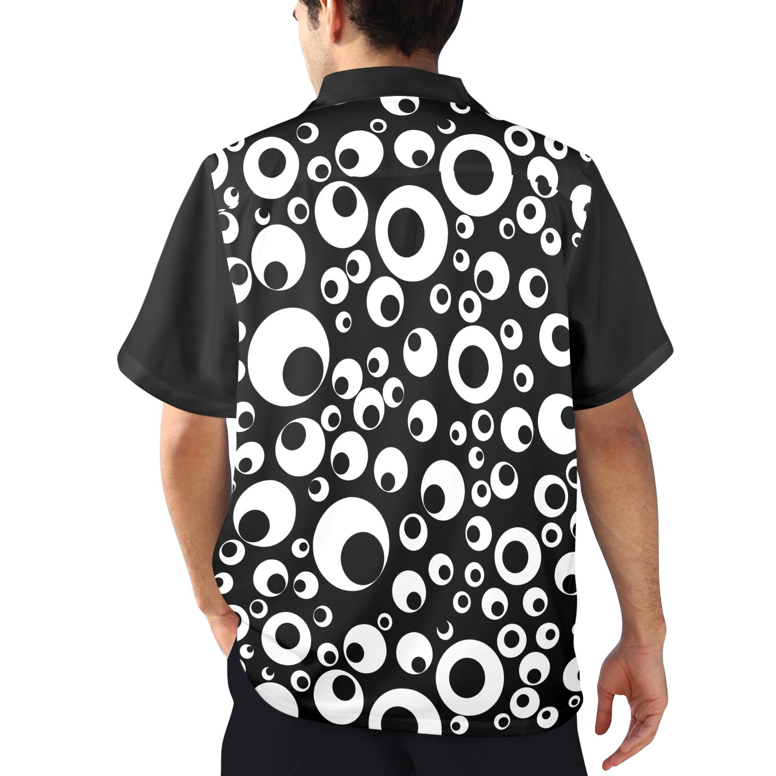 Black shirt with white circle pattern worn by a person on a white background
