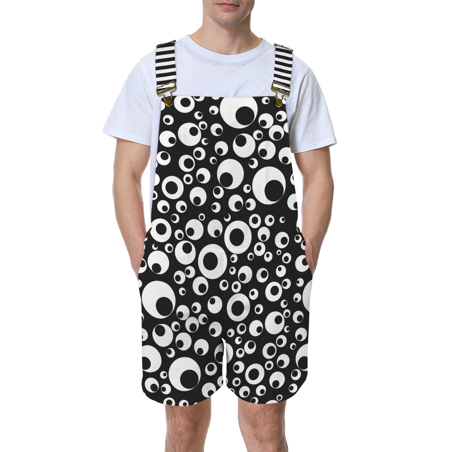 man wearing black and white googly eye print short overalls