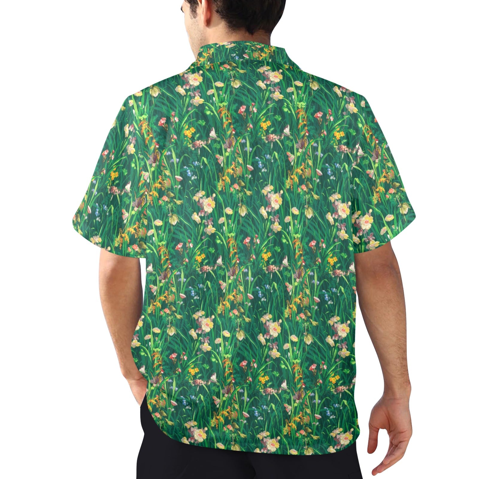 Man wearing a short-sleeve shirt with a floral pattern on a white background