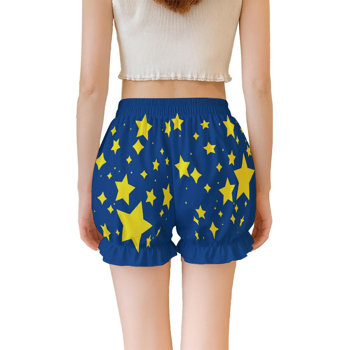 Blue shorts with yellow star pattern worn by a person on a white background