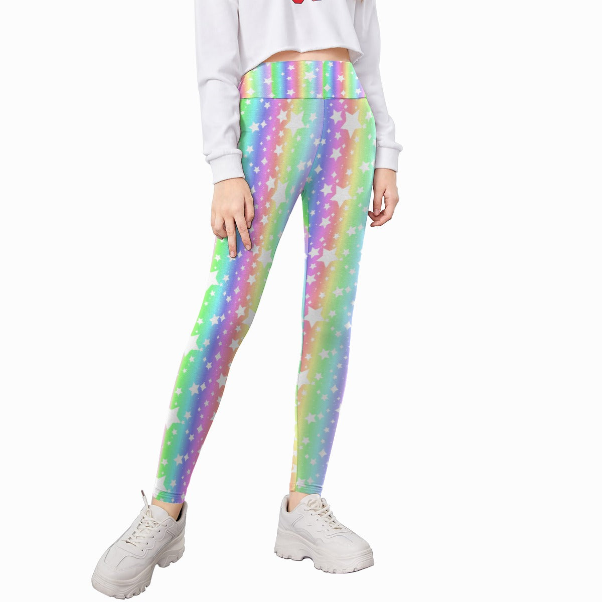 Kid wearing colorful star-patterned leggings on a white background