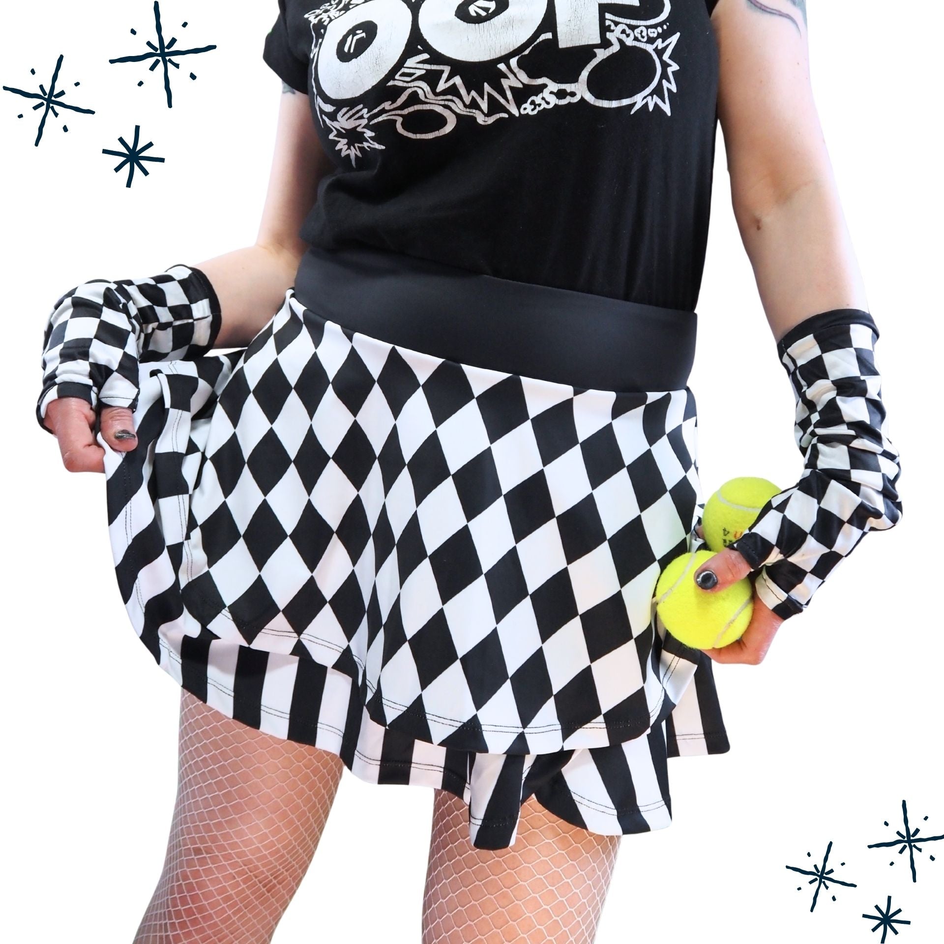 Person wearing a black and white checkered skirt with matching gloves and a black t-shirt with white graphics.