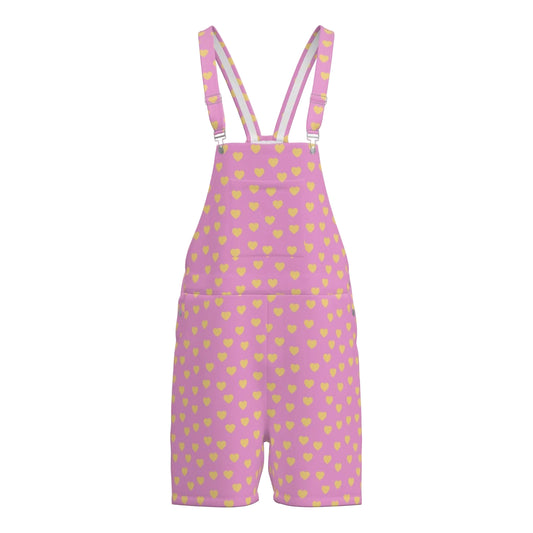 Pink overalls with yellow heart pattern on a white background