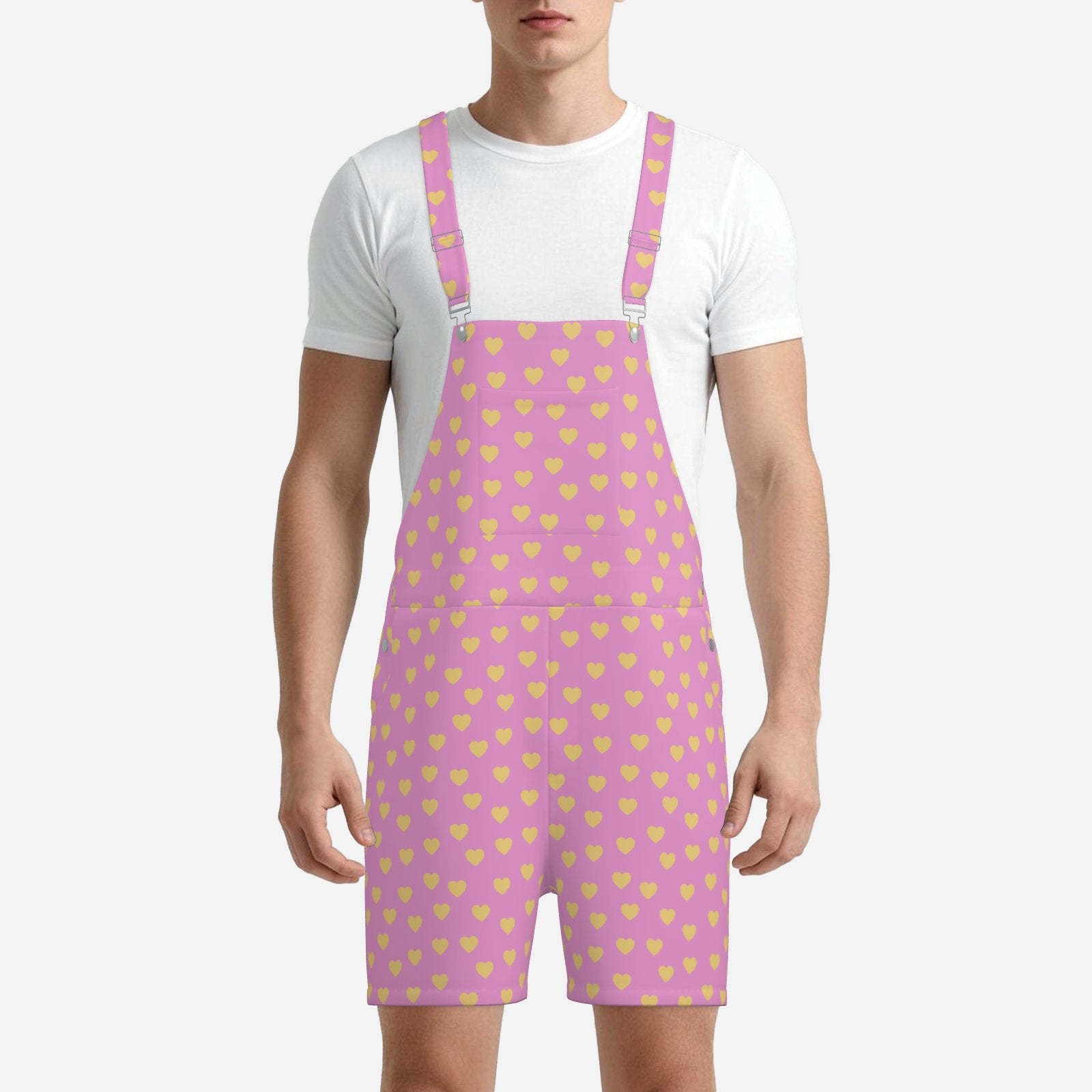 Person wearing a white t-shirt and pink overalls with yellow heart pattern on a white background