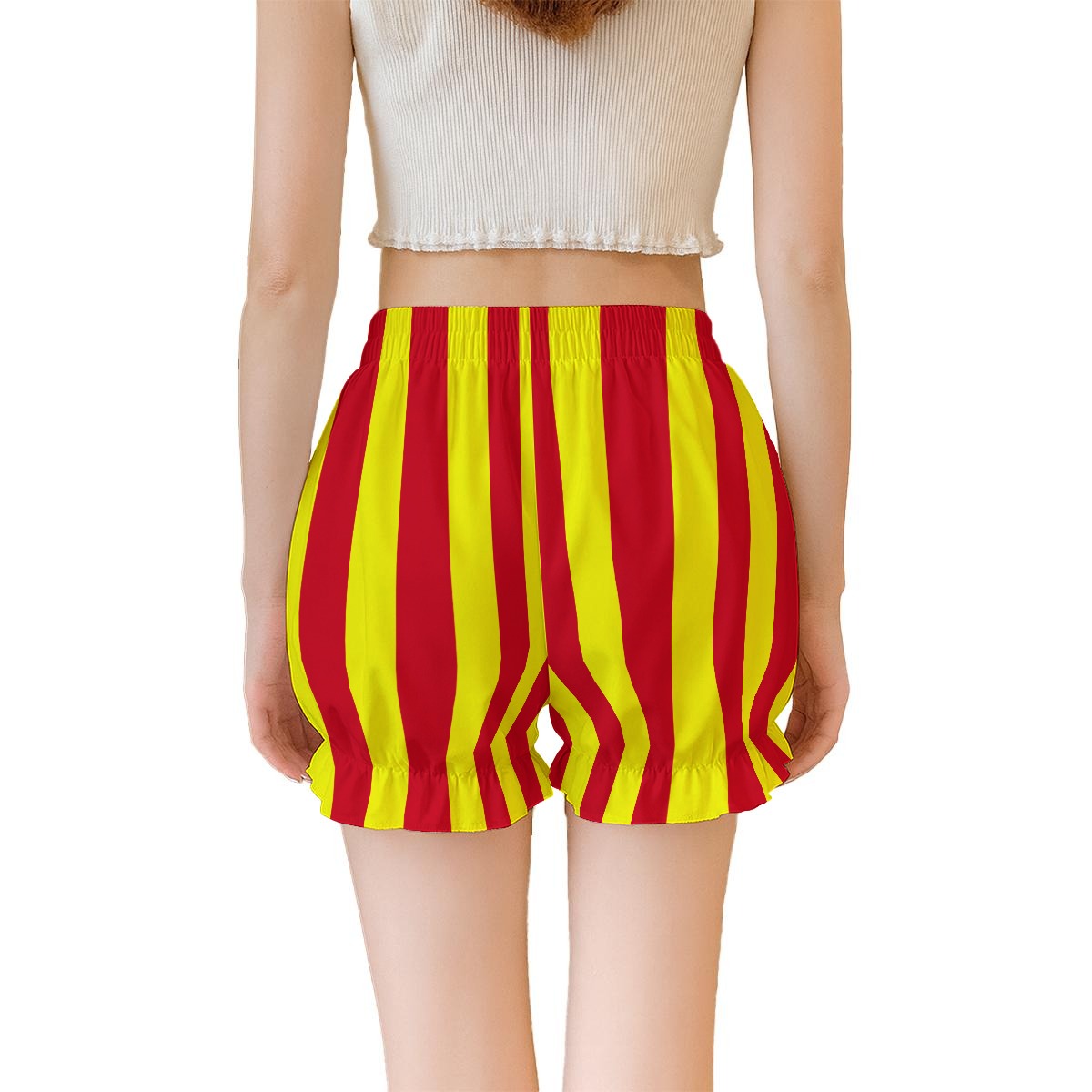 Red and yellow striped shorts worn by a person on a white background