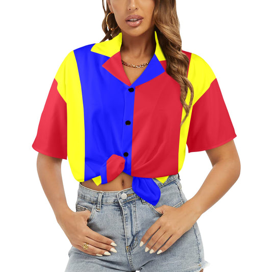 Woman wearing a colorful geometric-patterned shirt with a white background