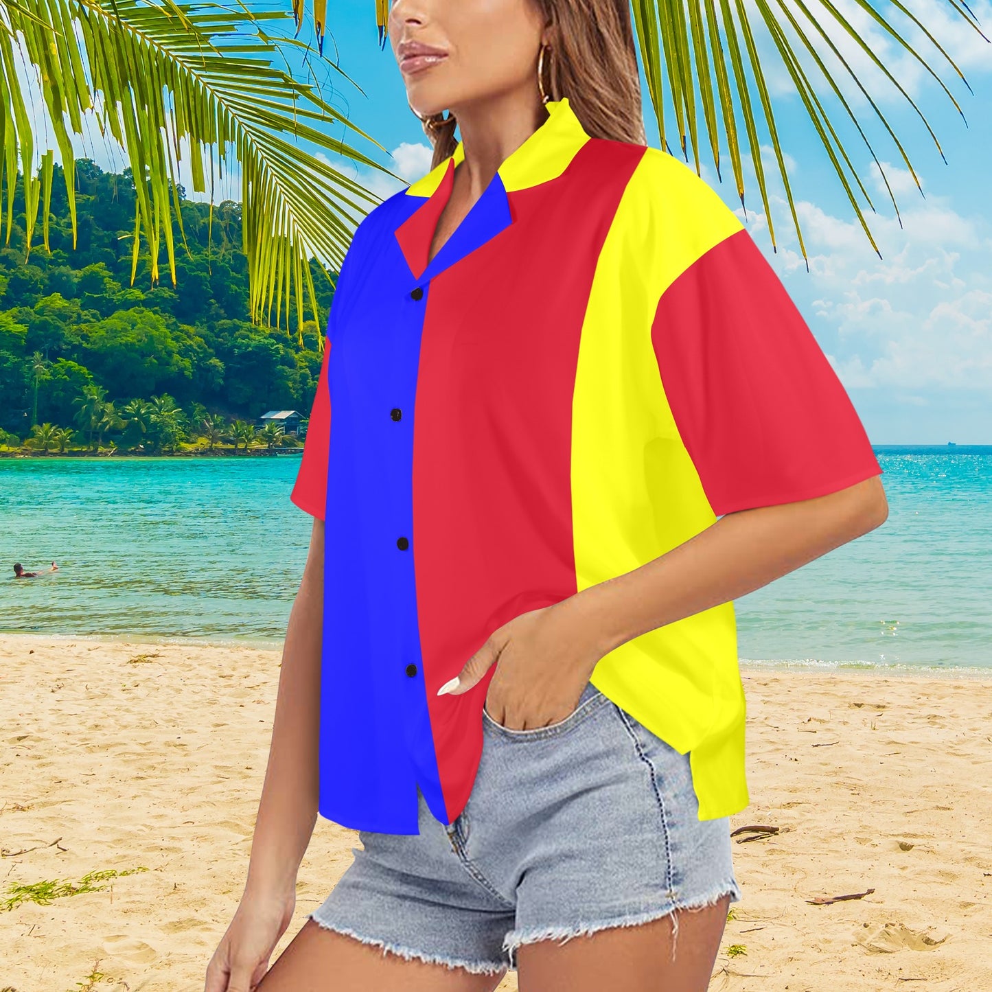 Person wearing a colorful shirt on a beach with palm trees and ocean in the background