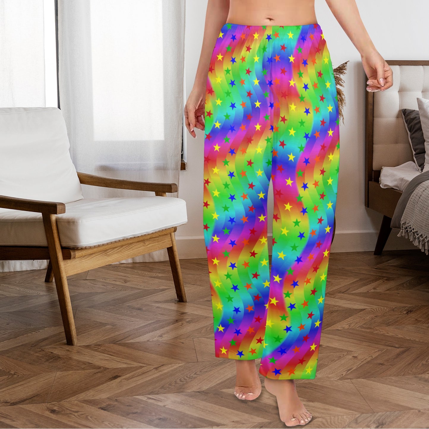 Person wearing colorful rainbow pants with star patterns in a room.