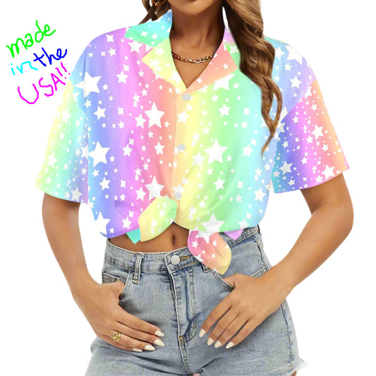 Woman wearing a colorful star-patterned shirt with a white background