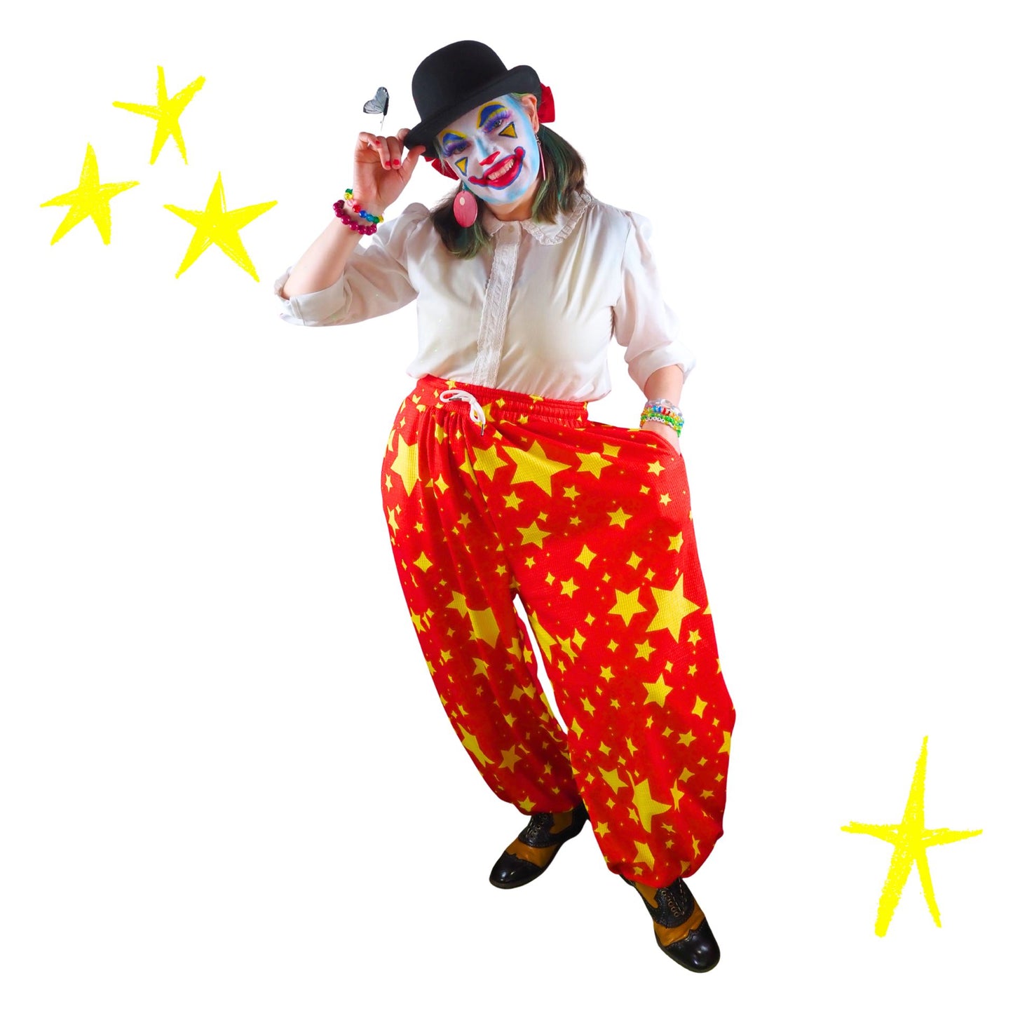 Person in clown costume with red pants and yellow stars, white shirt, and black shoes on a white background.
