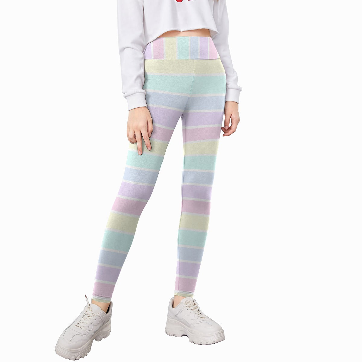 Kid wearing pastel striped leggings on a white background