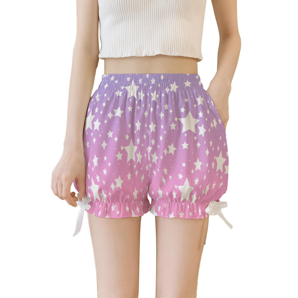 Purple pink ombre shorts with star pattern worn by a person on a white background