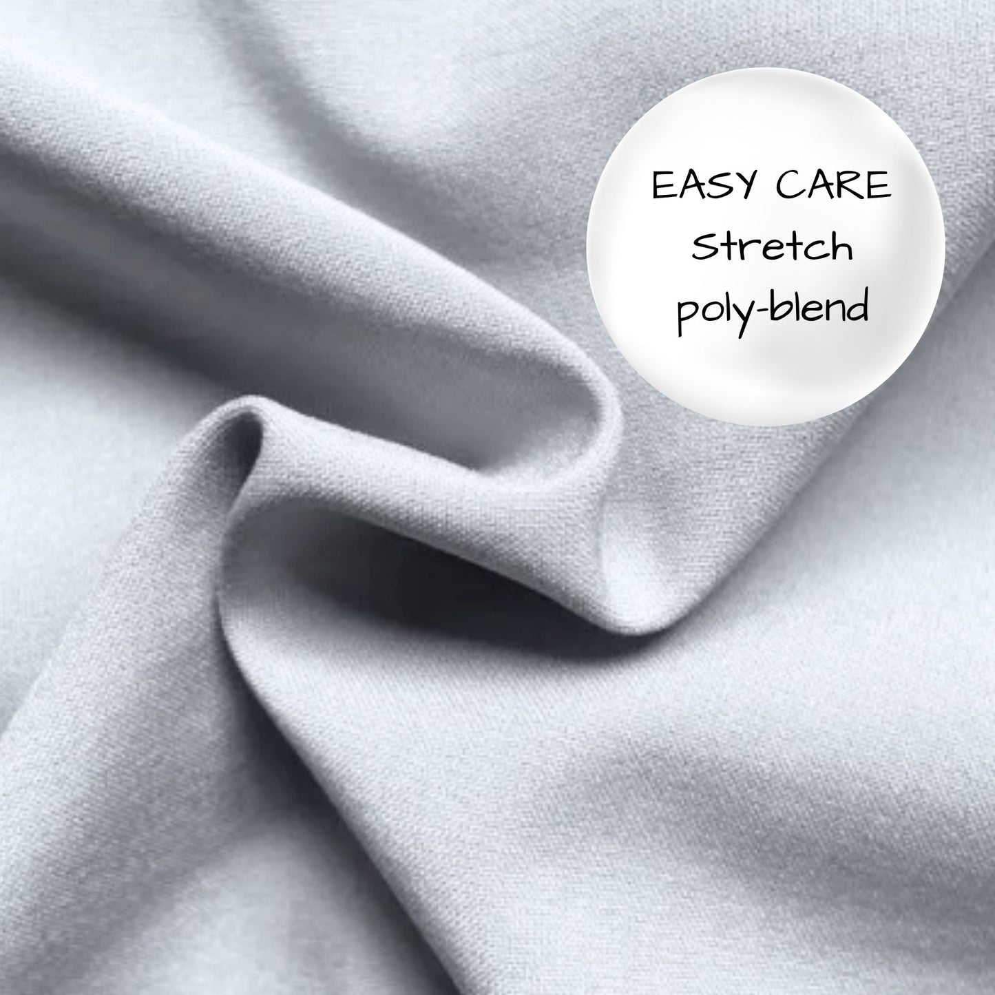 Close-up of gray fabric with 'Easy Care Stretch poly-blend' label