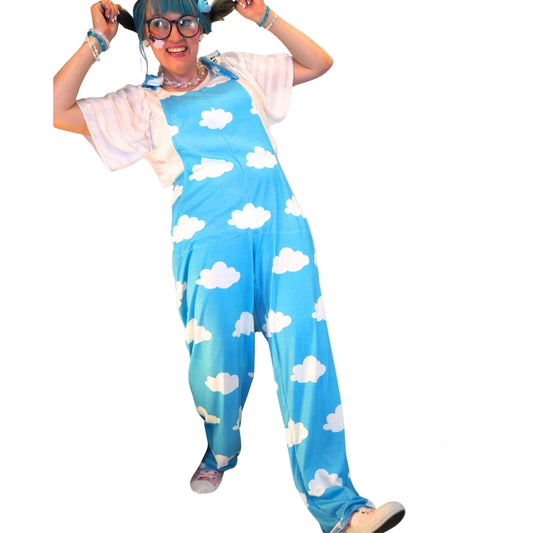 Person wearing a blue jumpsuit with white cloud patterns on a white background